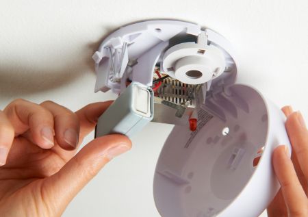 Replacing batteries in hard wired smoke alarms